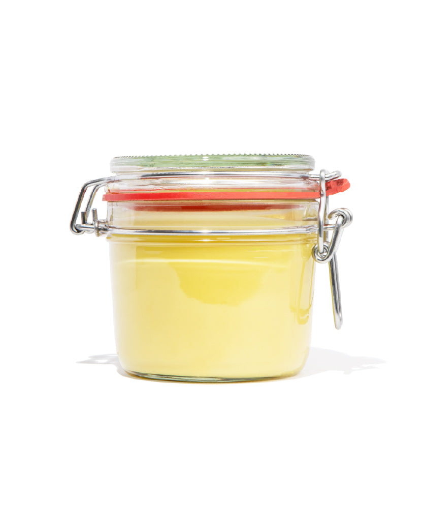 Patchouli Body Butter on a white background with minimal background, green label for eczema, dermatitis, and dry skin.